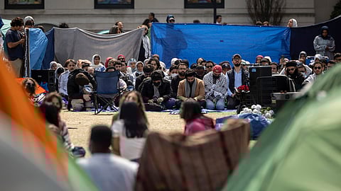 People pray during the Jummah prayer at the pro-Palestinian demonstration encampment at the Columbia University, Friday, April 26, 2024, in New York.