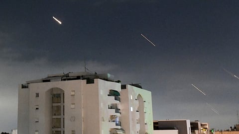 Israeli Iron Dome air defense system launches to intercept missiles fired from Iran, in central Israel, Sunday, April 14, 2024.