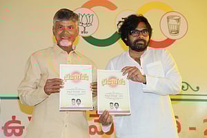 TDP leader N Chandrababu Naidu and JSP leader Pawan Kalyan with the joint manifestoreleased by TDP and JSP respectievely.