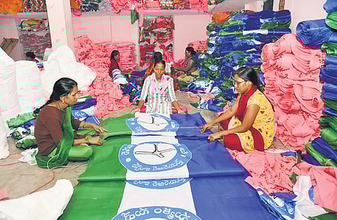 Women seen making flags for political parties in the Rajanna-Sircilla district