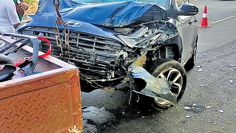 Mangled remains of the vehicle that rammed the cycle, and then crashed  into a median at Tharapakkam.