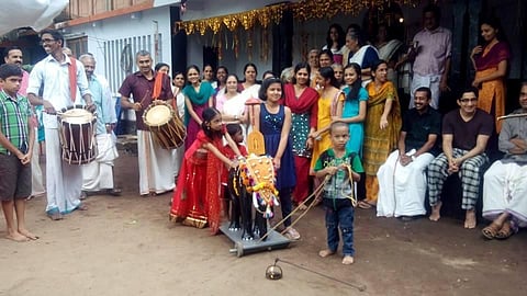 A temple procession organised by children at Puthen Kovilakam in Kodungallur.