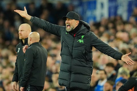 Liverpool's manager Jurgen Klopp yells during the English Premier League soccer match between Everton and Liverpool at the Goodison Park stadium in Liverpool, Britain, Wednesday, April 24, 2024. 