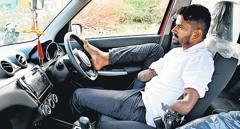 Thansean, after getting fitness certificate can be seen driving the car with his legs with hands on the keys of the modified vehicle