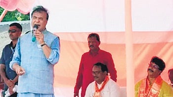 Assam CM Biswa Sarma addressing a public meeting in Suliapada