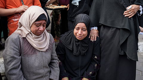 Mourners react next to the bodies of Palestinians who were killed in an Israeli airstrike in Gaza Stirp, at the Al Aqsa hospital in Deir al Balah, Gaza.