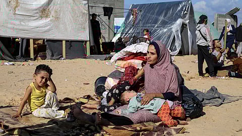 Palestinians displaced by the Israeli bombardment of the Gaza Strip set up a tent camp in Rafah.