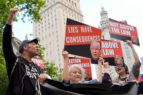 Former President Donald Trump talks to the media after a day of testimony in his trial at Manhattan Criminal court in New York, on May 10, 2024.