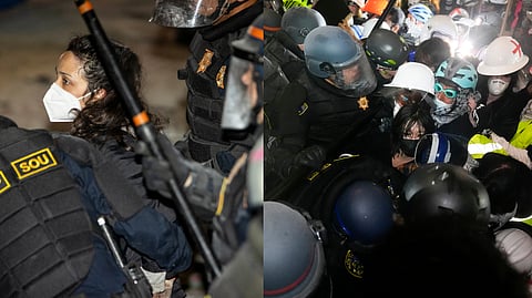 Police face off with pro-Palestinian demonstrators inside an encampment on the UCLA campus Thursday.