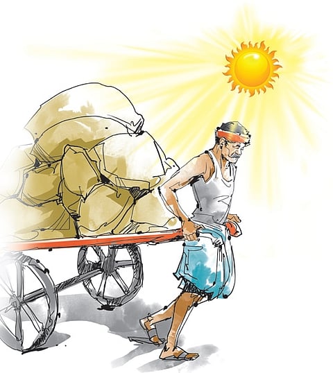 Children bathe from a pipe on a hot summer day amid heatwave.