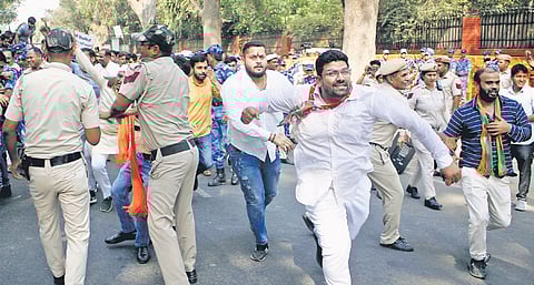 BJP workers during a protest near Congress HQ at Akbar Road