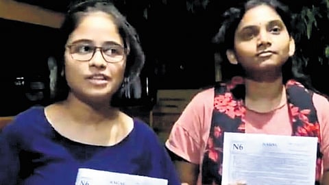 In a video making rounds on social media, two girls who attended NEET at Asifabad Model School said they received a different question paper from other centres