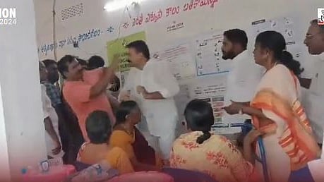 YSRCP MLA Siva Kumar slaps a voter outside a polling station. 