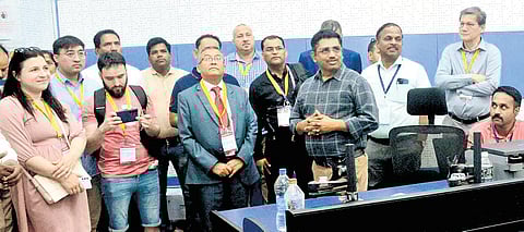 An official explains the workings of the Media Certification and Monitoring Centre to a delegation of election representatives of five countries, in Belagavi on Monday 
