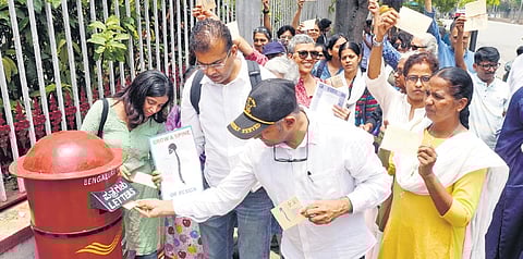 Members of civil society groups send postcards 