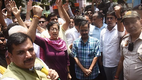 Delhi CM Arvind Kejriwal, along with AAP leaders, march towards the BJP headquarters in New Delhi on Sunday, May 19, 2024.