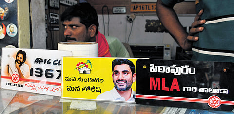 Stickers of ‘Pithapuram MLA Gari Taluka’ and ‘Mana Mangalagiri Mana Lokesh’ at a stickering shop in Vijayawada
