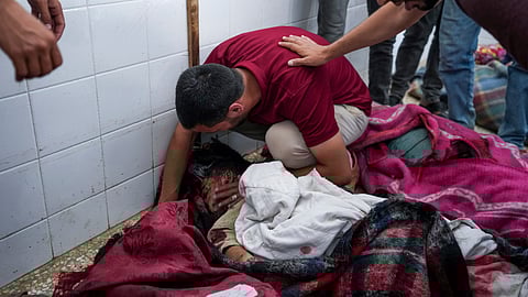 Palestinians mourn the bodies of their relatives killed in an Israeli bombardment of the Gaza Strip, at the Al Aqsa hospital in Deir al Balah, central Gaza Strip.