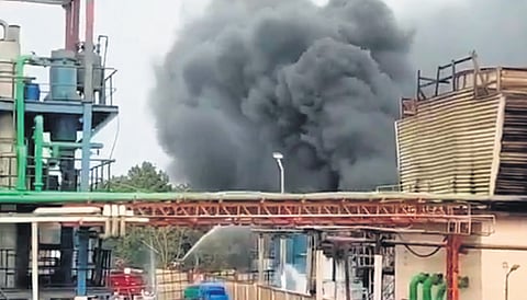 Smoke bellows out the Hetero Labs Ltd at Gaddapotharam Industrial area in Jinnaram mandal of Sangareddy district on Monday