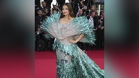 Aishwarya Rai Bachchan poses for photographers upon arrival at the premiere of the film 'Kinds of Kindness' at the 77th international film festival, Cannes, southern France, Friday, May 17, 2024. 
