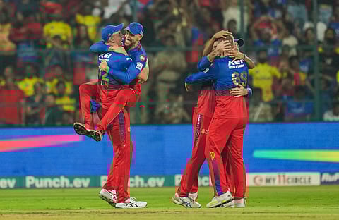 Royal Challengers Bengaluru players celebrate the wicket of Chennai Super Kings batter Ajinkya Rahane during the Indian Premier League (IPL) match in Bengaluru (Photo | PTI)