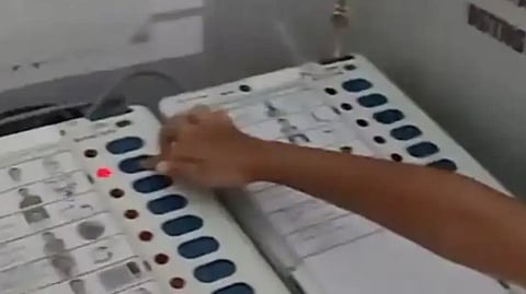 BJP leader Vishnu Khatri's son casts vote for his father in a polling booth in Bhopal. 