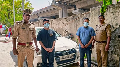 Police with the two accused who were arrested in connection with the Audi hit-and-run accident in Sector 24 that killed an elderly man, in Noida.