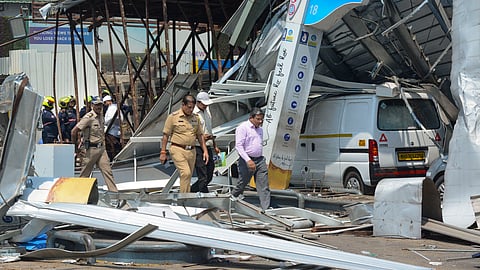 View of the site of the hoarding collapse, that is being cooled by the fire brigade personnel at Ghatkopar, in Mumbai, on Tuesday, May 14, 2024.