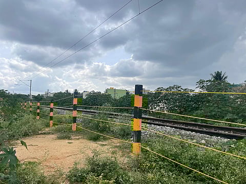 Barricading of railway tracks at Heelalige by L&T to start work in connection with the Heelalige-Rajanakunte corridor of the Bengaluru Suburban Railway Project (Photo | Express)
