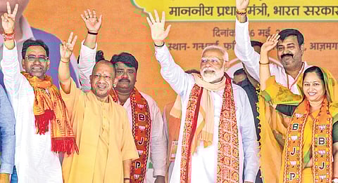 PM Narendra Modi and Uttar Pradesh CM Yogi Adityanath during a public meeting at Lalganj in Uttar Pradesh’s Azamgarh on Thursday.