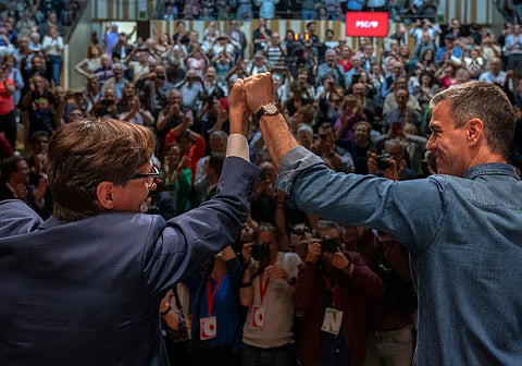 Spanish Prime Minister Pedro Sanchez and socialist candidate, Salvador Illa wave to the crowd during a campaign rally in Villanova i la Gertru, near Barcelona, Spain, Thursday, 