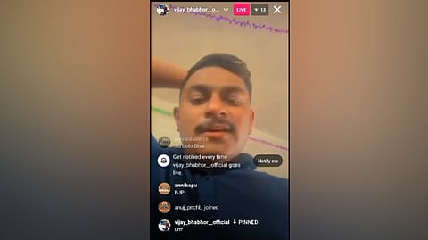 A screen grab of the video live streamed by the son of BJP leader after taking control of a polling booth in Gujarat's Mahisagar district. 