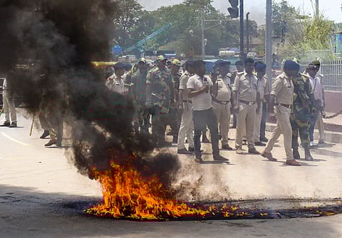 Security personnel deployed to maintain law and order following a protest by college students after a final year student was beaten to death by some unidentified persons on the law college campus of Patna University, in Patna, Tuesday, May 28, 2024.