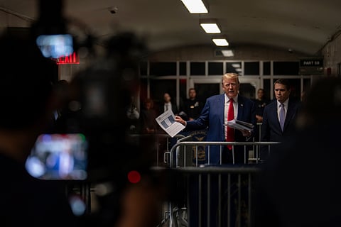 (From left) North Dakota Gov. Doug Burgum, U.S. Speaker of the House Mike Johnson and businessman Vivek Ramaswamy look on as former President Donald Trump talks to the media as he arrives at Manhattan criminal court in New York, on May 14, 2024.
