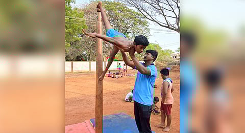 A student learning Malar Kambam at the Anna Stadium in Tiruchy.