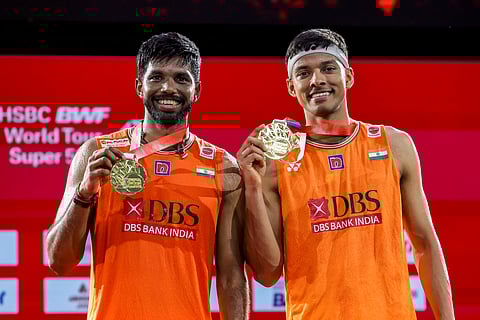 Satwiksairaj Rankireddy and Chirag Shetty pose for photographs after winning the Thailand Open Super 500 title, beating the Chinese pair of Chen Bo Yang and Liu Yi on May 19, 2024.