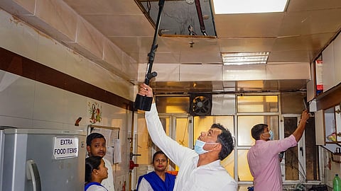 Security personnel inspect inside the GTB Hospital after four Delhi hospitals received bomb threats via email, in New Delhi, Tuesday, May 14, 2024.