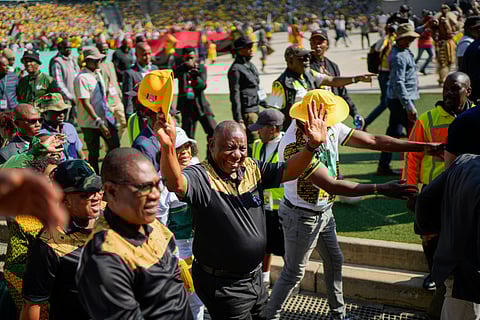 South African President Cyril Ramaphosa greets African National Congress supporters at the Siyanqoba rally at FNB stadium in Johannesburg, South Africa, Saturday, May 25, 2024. 
