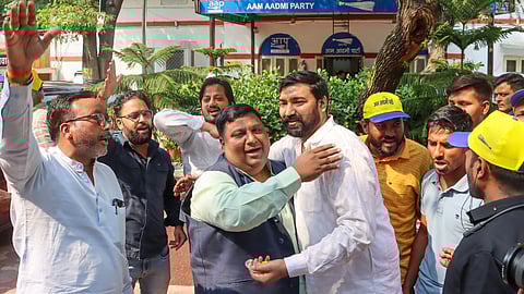 Delhi minister and AAP leader Imran Hussain celebrates with party workers after the Supreme Court granted interim bail to Delhi Chief Minister and AAP convenor Arvind Kejriwal till June 1.