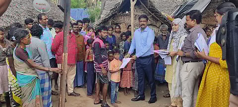 Tirupattur Collector K Tharpagaraj distributing community certificates to students belonging to the Irular community in Bapanapalli on Thursday