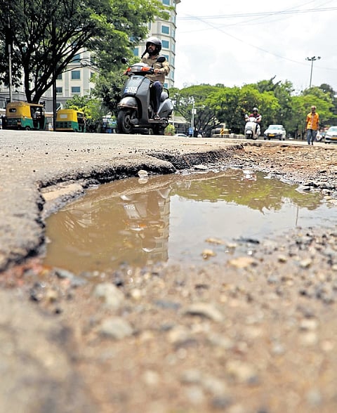 Potholes on Race Course Road pose danger for motorists during the monsoon season 