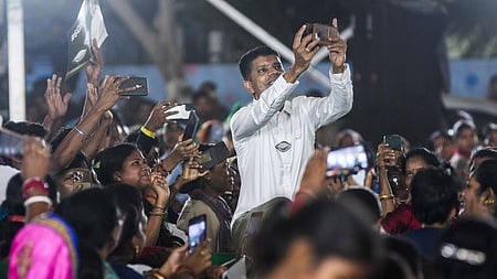 BJD star campaigner VK Pandian with people while campaigning.
