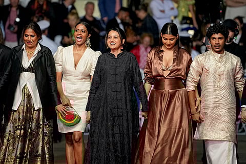 Chhaya Kadam, Kani Kusruti, director Payal Kapadia, Divya Prabha and Hridhu Haroon pose for photographers upon arrival at the premiere of the film 'All We Imagine as Light' at the 77th international film festival, Cannes, southern France.