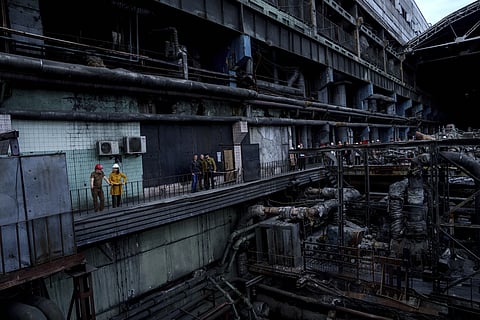 German Foreign Minister Annalena Baerbock speaks to Ukrainian Energy Minister Herman Halushchenko during official visit to a thermal power plant which was destroyed by a Russian rocket attack in Ukraine, Tuesday, May 21, 2024.