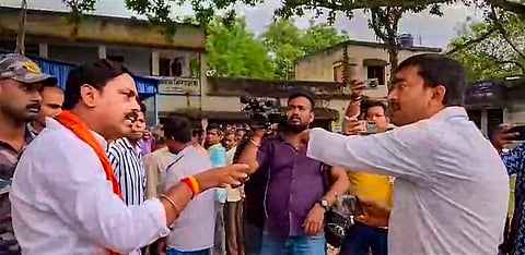 TMC and BJP leaders clash outside a polling station during voting for the 3rd phase of Lok Sabha elections, in Murshidabad, Tuesday, May 7, 2024. 