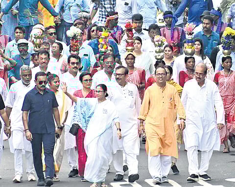 walking an extra mile: West Bengal CM Mamata Banerjee during a 12-km roadshow in South Kolkata on the last day of campaigning 