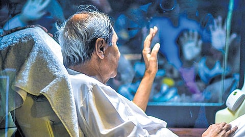 CM Naveen Patnaik waving to the crowd during the roadshow.