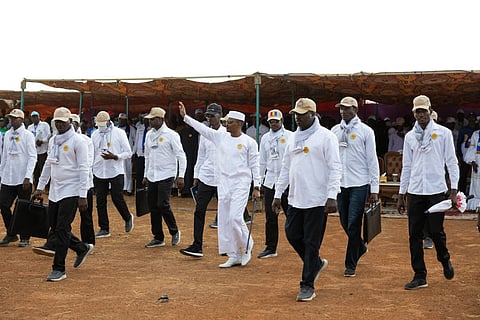 Mahamat Idriss Deby Itno, transitional president and candidate for the presidential election in Chad, walks towards the stage