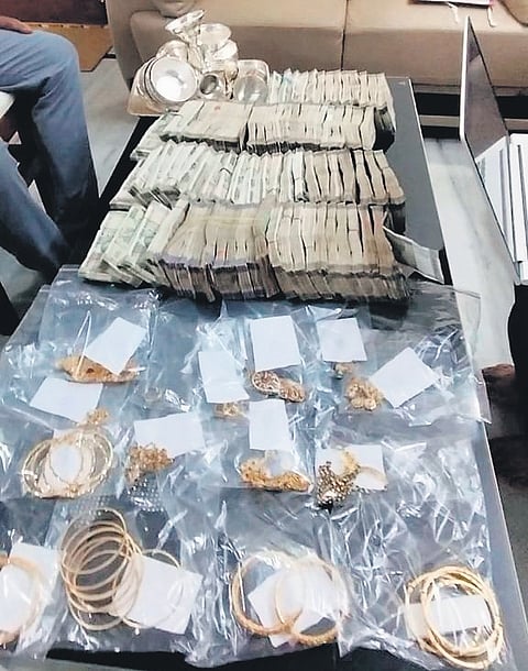 Bundles of cash and gold jewellery seized by the ACB during raids at the residence of Hyderabad CCS ACP Uma Maheshwar Rao in Hyderabad on Tuesday