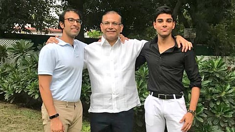 Aashir Sinha (R) poses along with his father and BJP leader Jayant Sinha (C) and brother Rishabh Sinha.